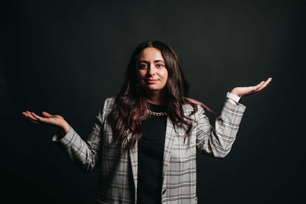 woman in black and white plaid blazer