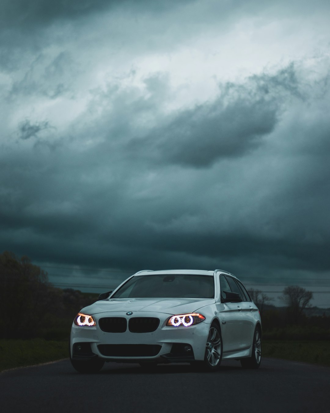 white bmw m 3 on road