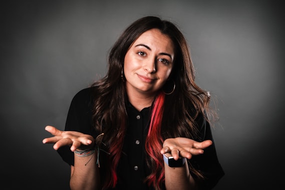 A woman shrugging, palms open &mdash; the "I don't know" every AI vendor avoids putting a number on