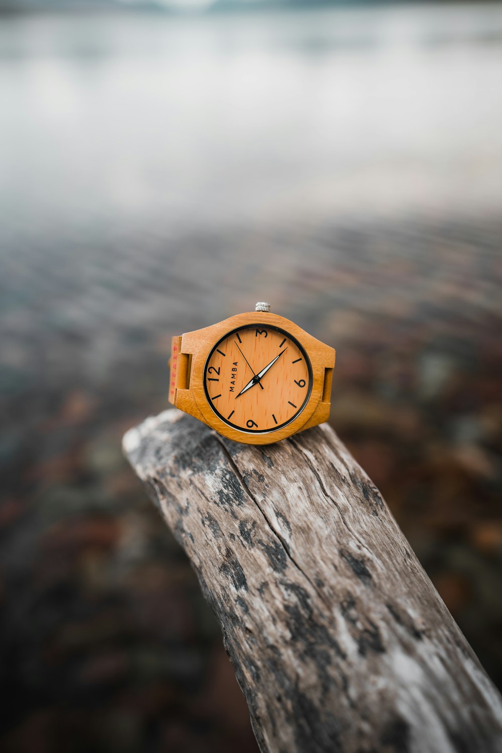 brown wooden analog watch at 10 30