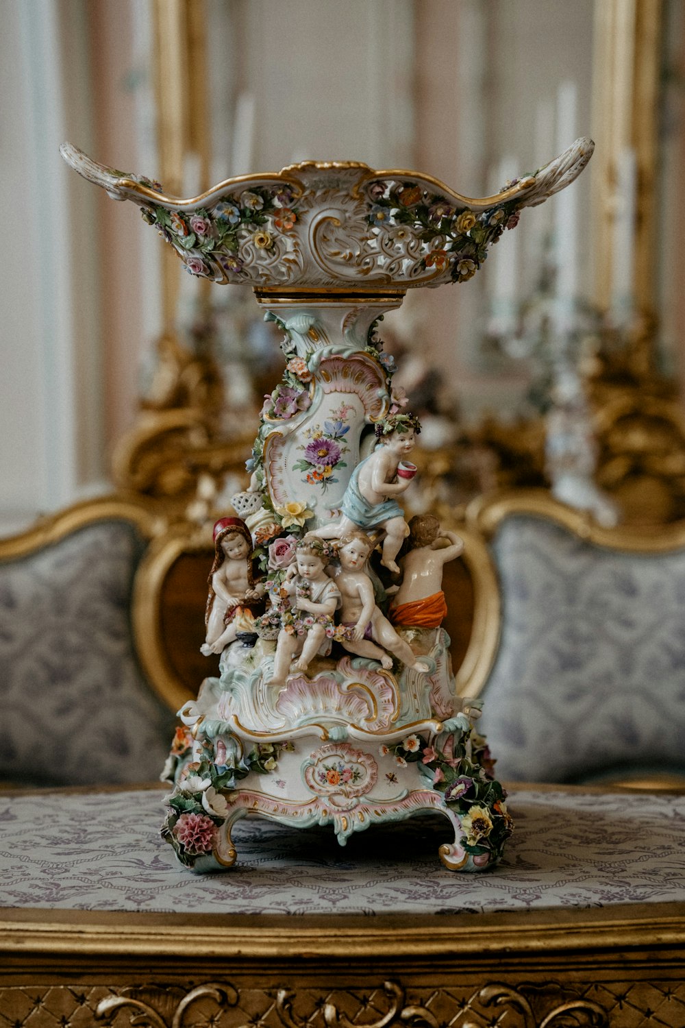 gold and white floral ceramic figurine