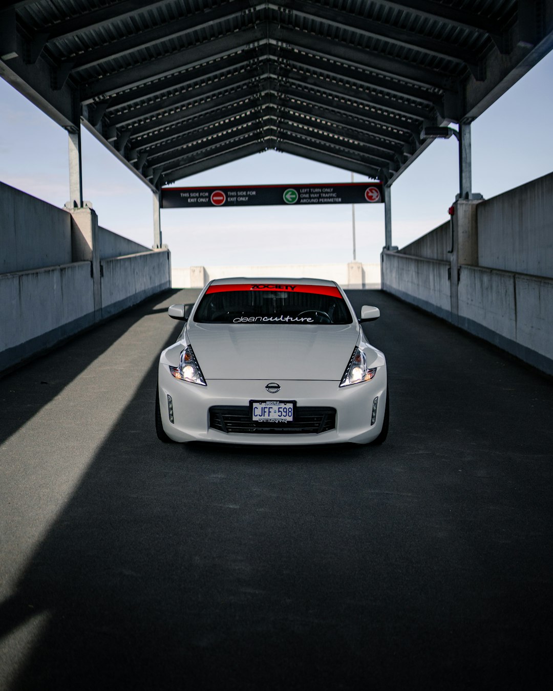 white porsche 911 parked in a parking lot