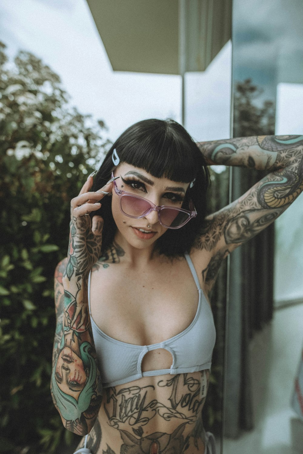 woman in white tank top wearing sunglasses