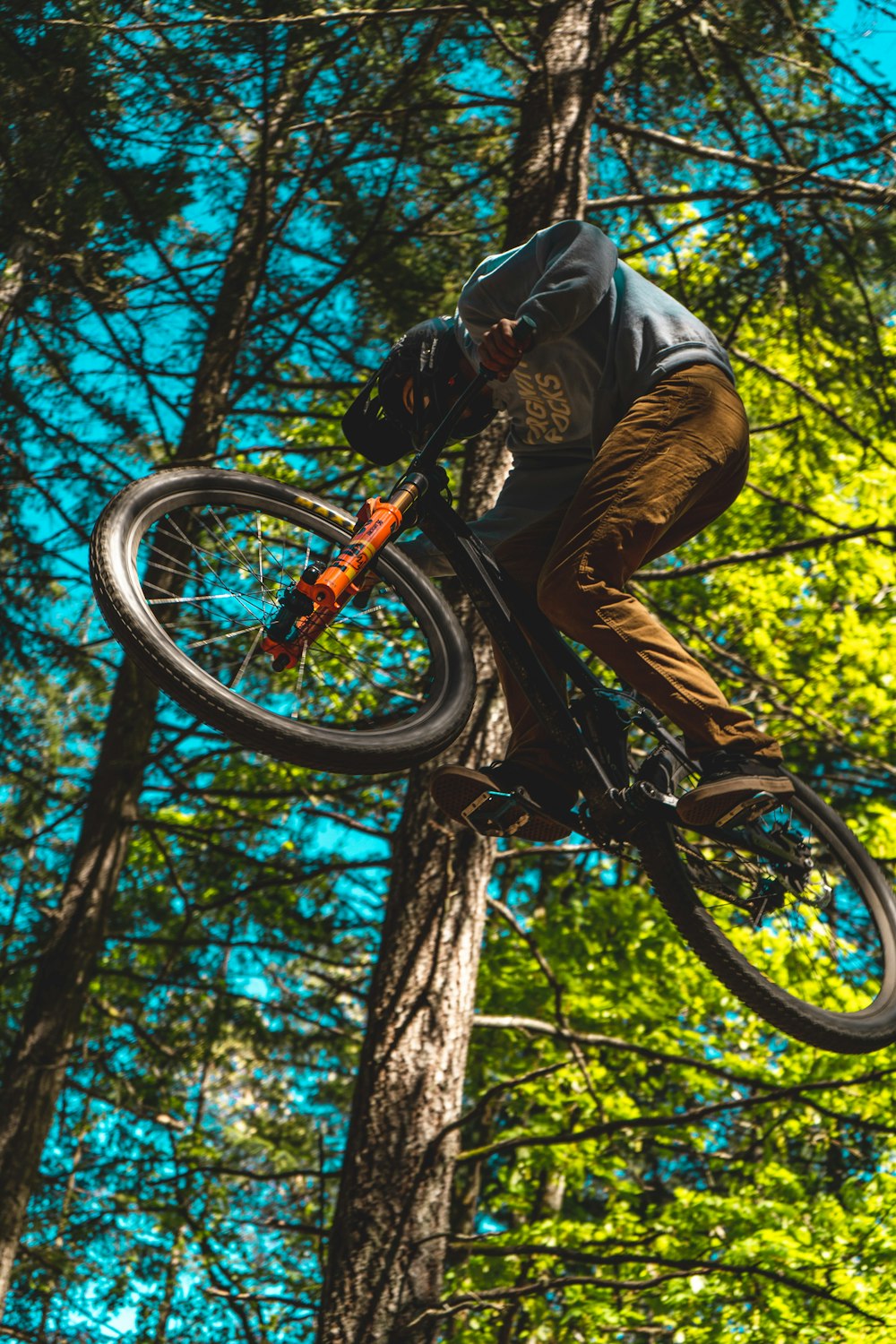 man in black t-shirt riding bicycle