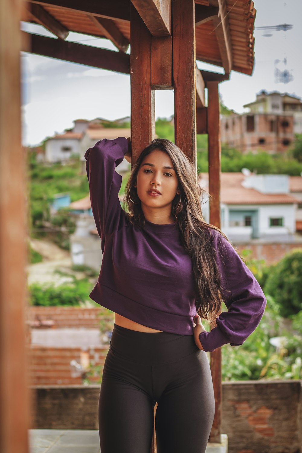 woman in purple long sleeve shirt and black skirt