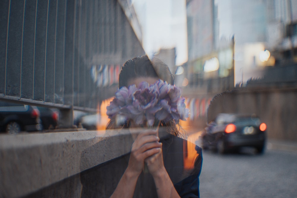 person holding white and pink flower