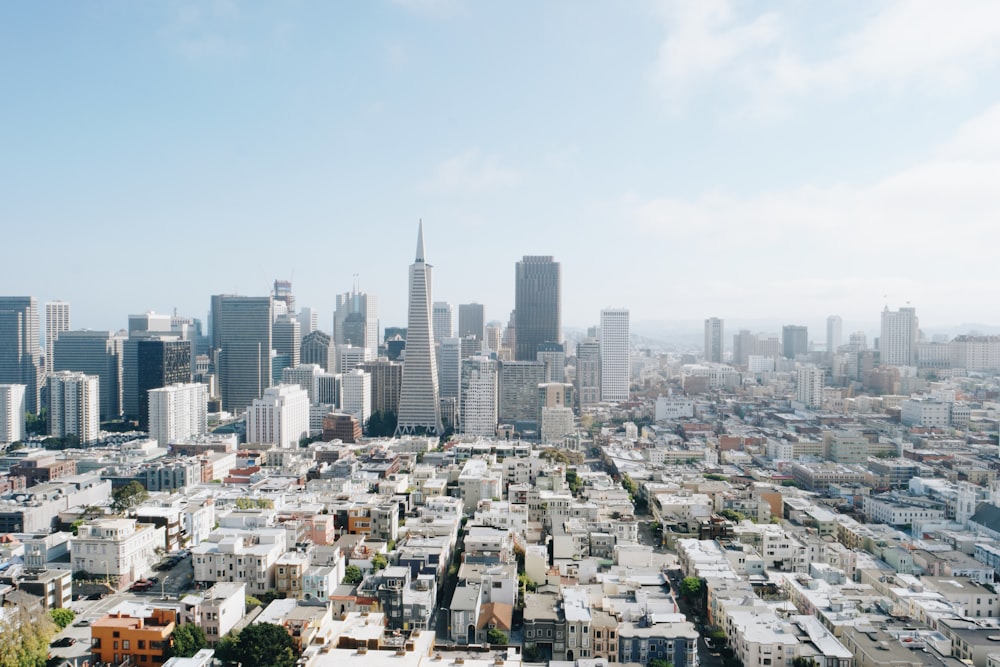 city buildings under blue sky during daytime