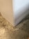 Close-up of a smooth concrete floor being polished in an industrial setting.