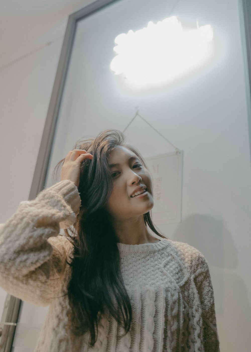 woman in white knit sweater