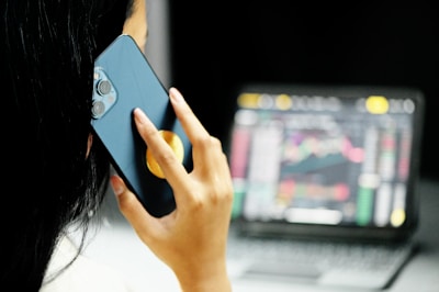 woman holding blue smartphone with blue case