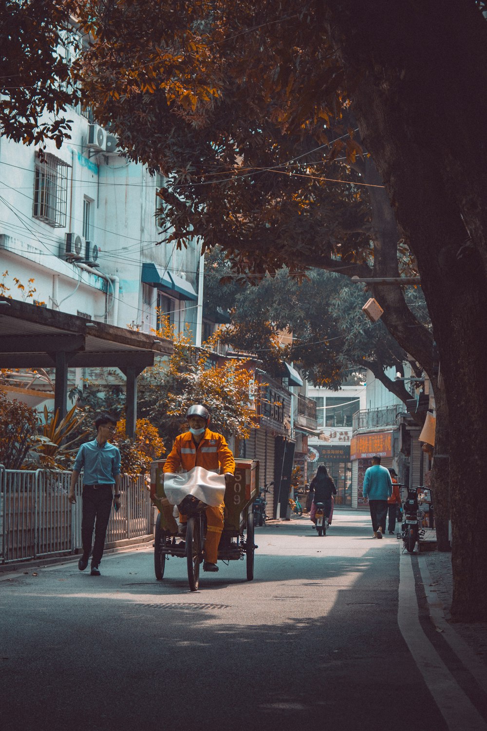 people walking on sidewalk during daytime