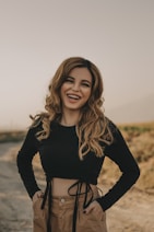 woman in black long sleeve shirt smiling