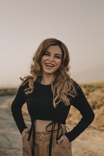 woman in black long sleeve shirt smiling