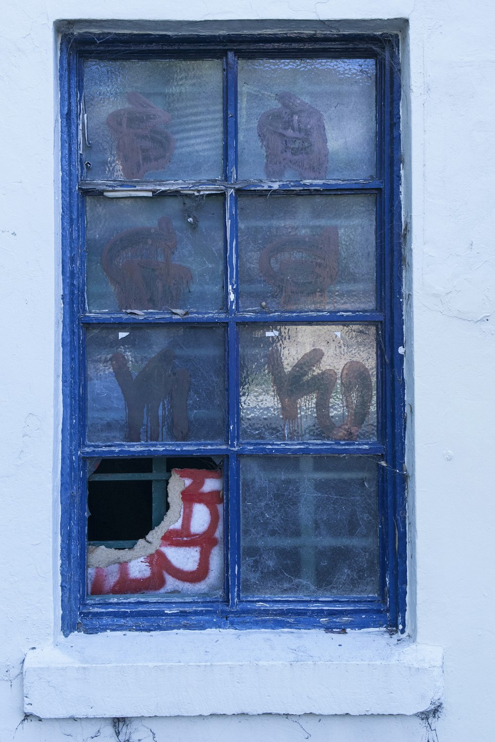 blue wooden window with red love print