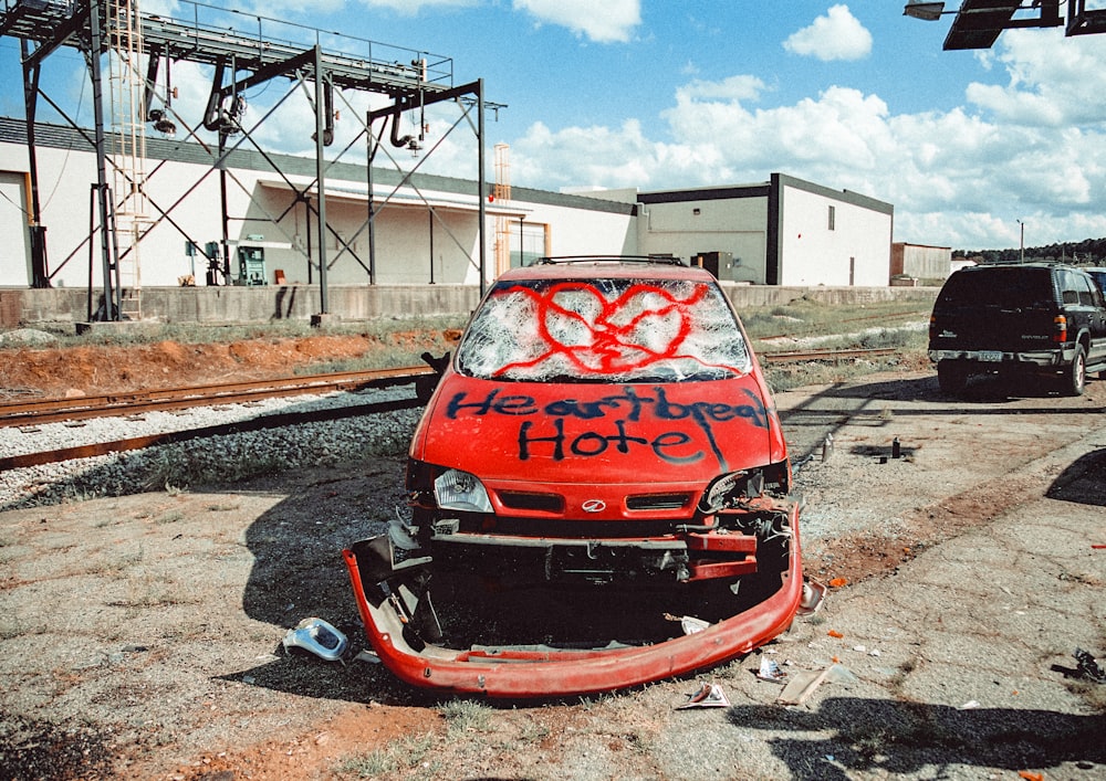 red and black car on road during daytime