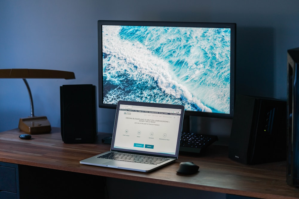 macbook pro on brown wooden table