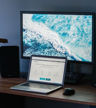 macbook pro on brown wooden table