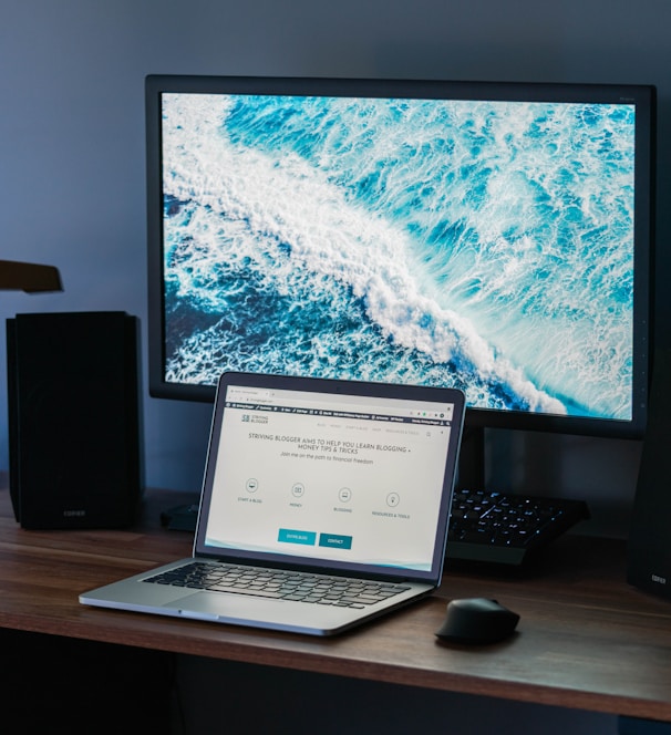 macbook pro on brown wooden table