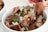 A satisfied customer cooking with Noura Foods halal meat.