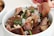 A satisfied customer cooking with Noura Foods halal meat.