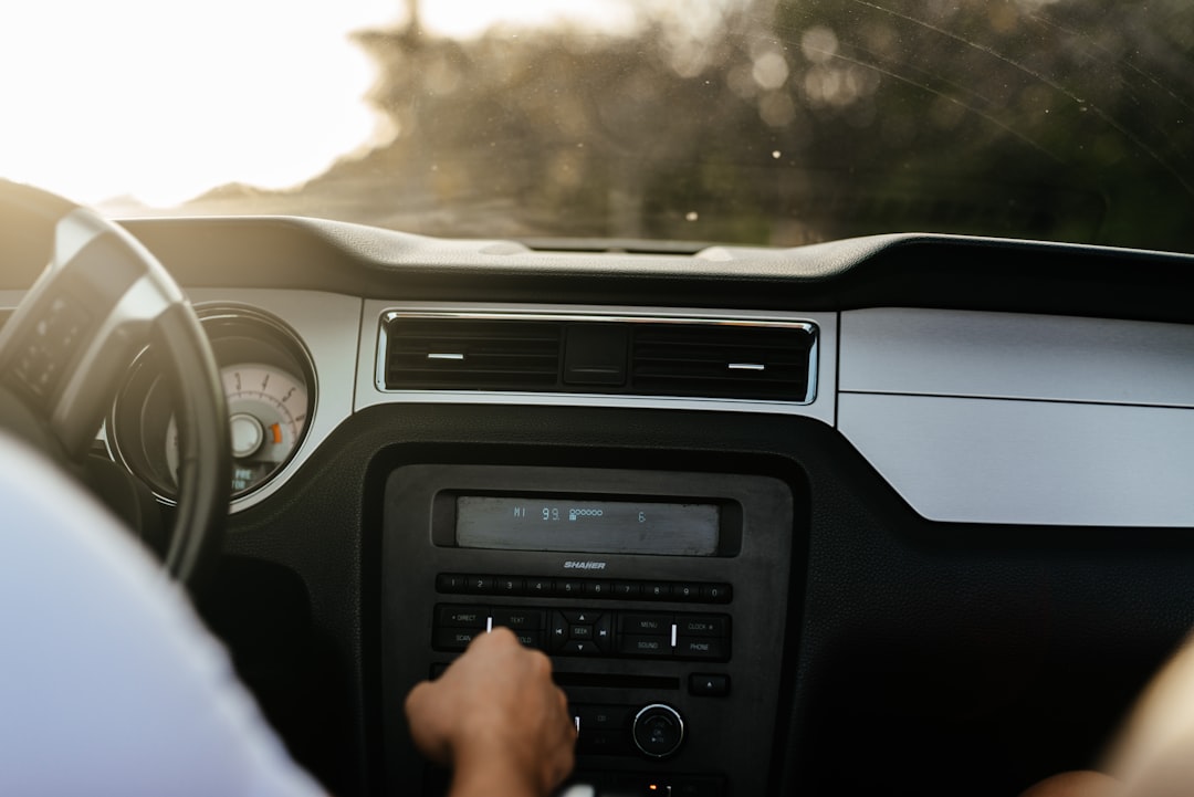 person driving car during daytime