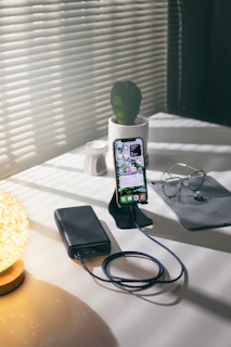black iphone 4 on table