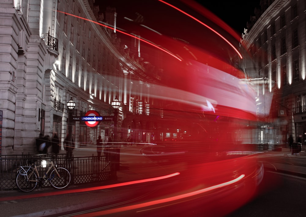 red car on road during night time