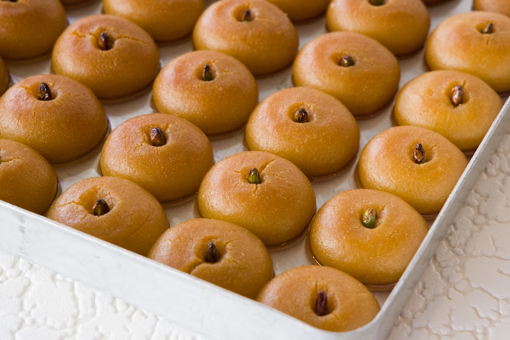 brown round fruit on white box