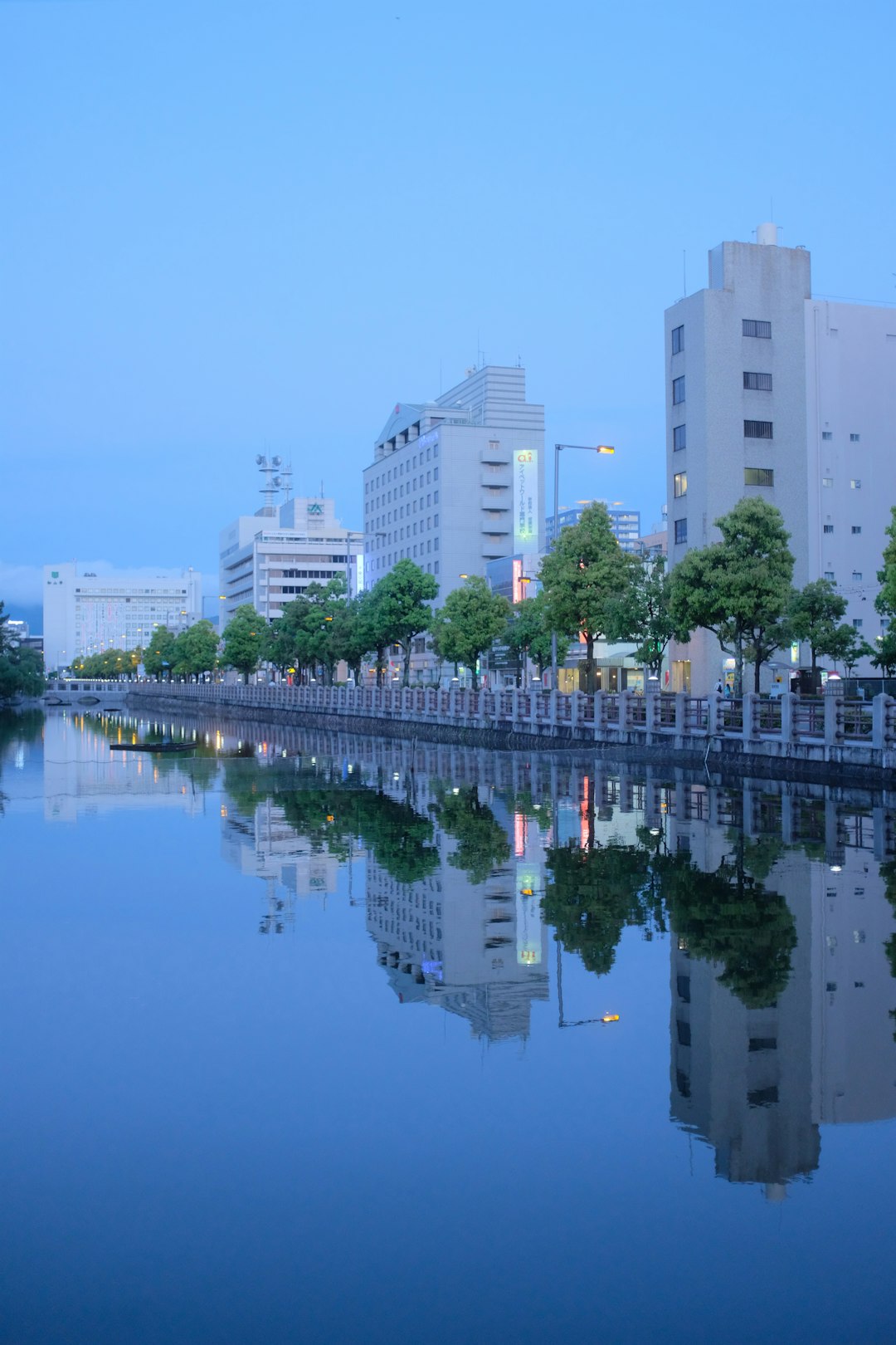 white concrete building near body of water during daytime