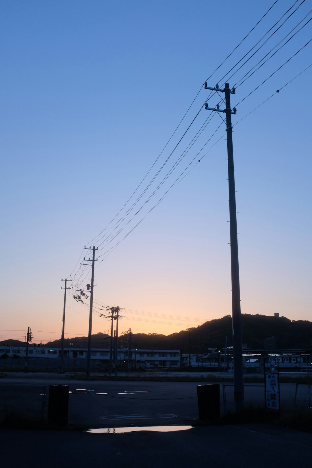 gray electric post during sunset