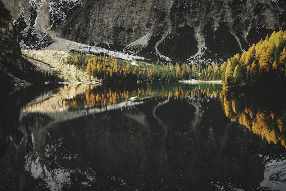 lake near mountain during daytime