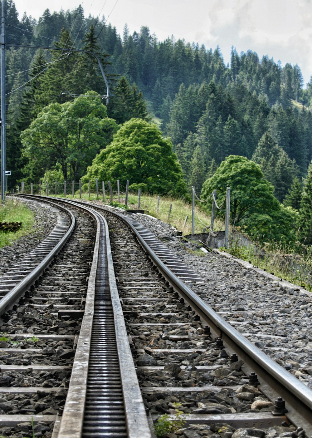 a train track with trees in the background