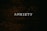 A dark wooden textured background with the word 'ANXIETY' in white capital letters centered prominently.