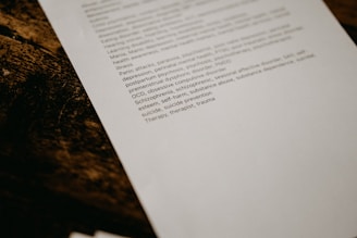 white printer paper on black and brown granite table