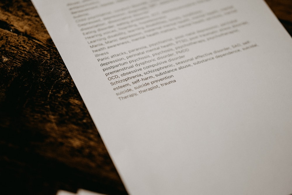 white printer paper on black and brown granite table