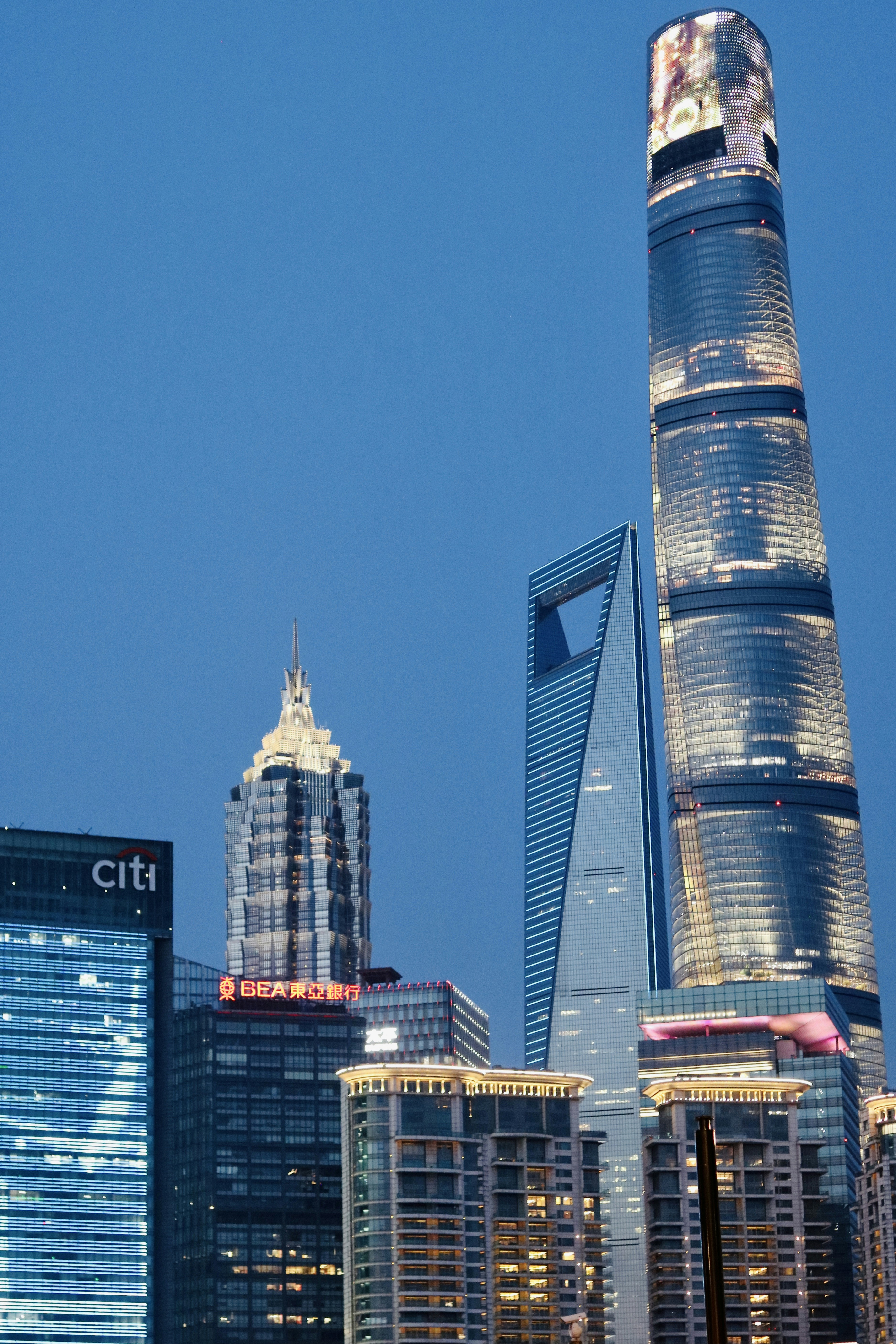 a city skyline with skyscrapers lit up at night
