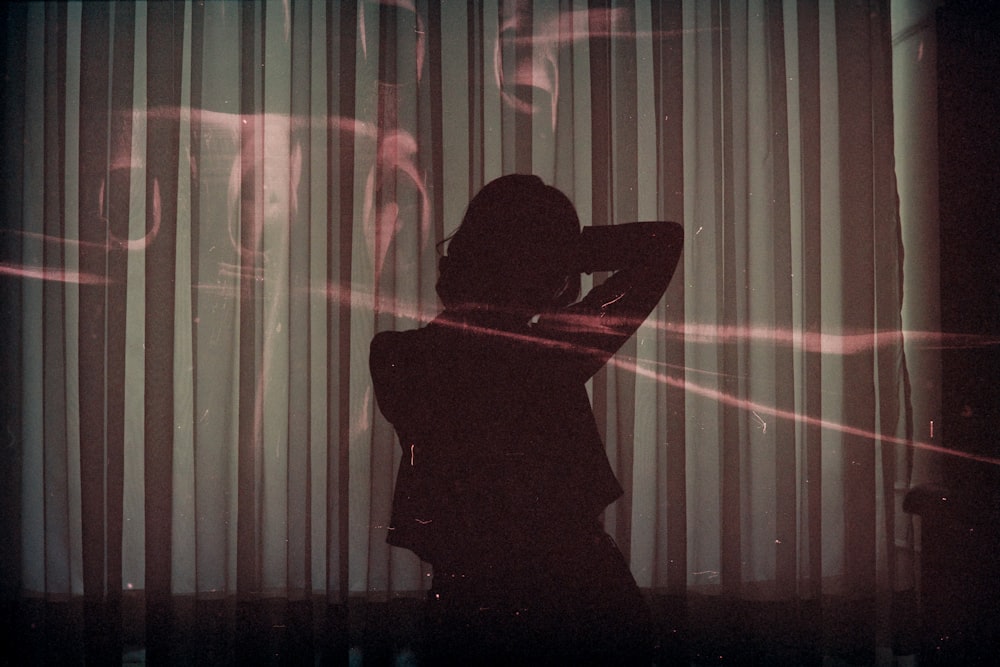 silhouette of woman sitting on chair