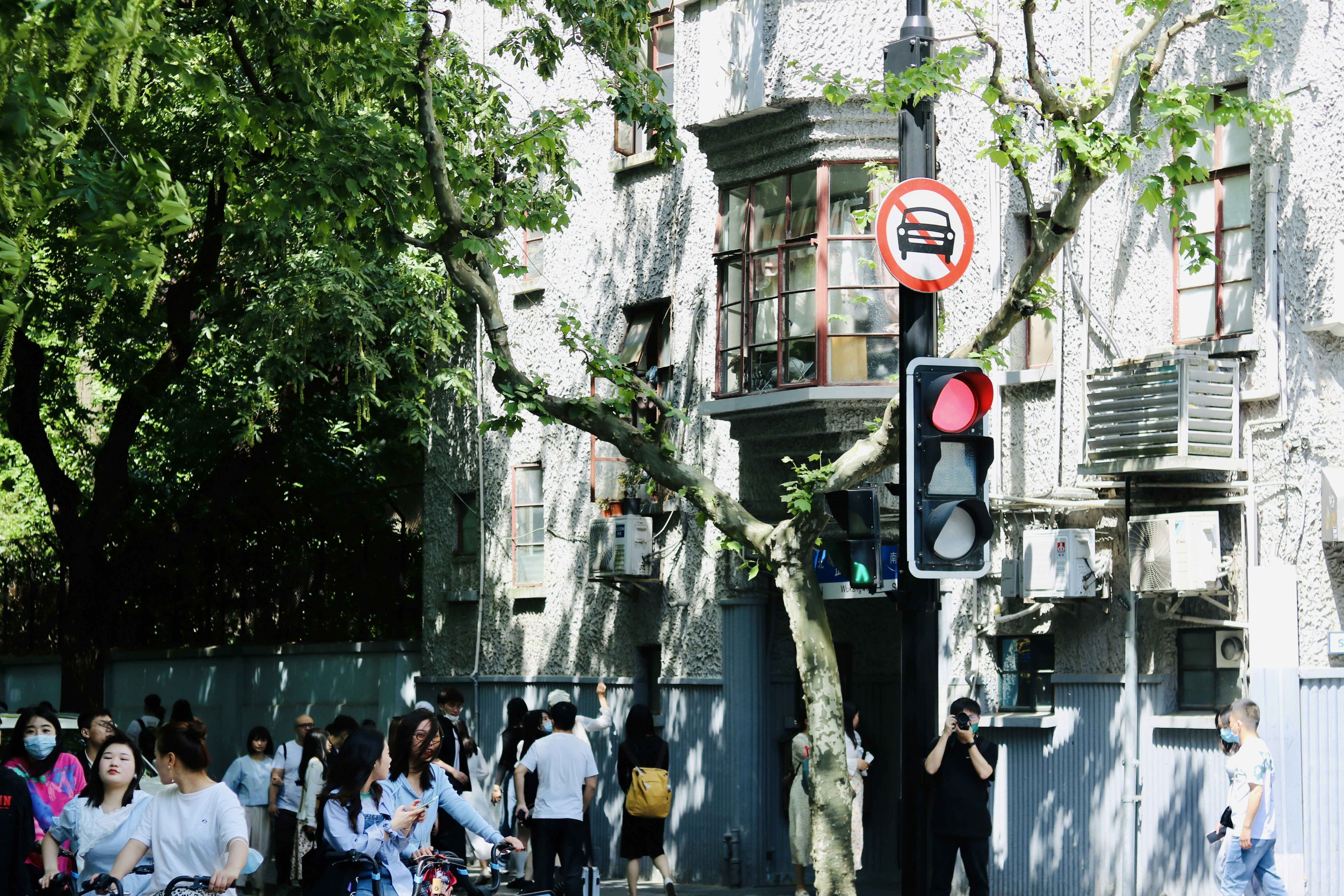 a group of people standing outside of a building