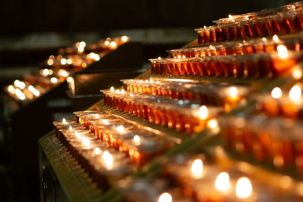 red candles on brown wooden rack