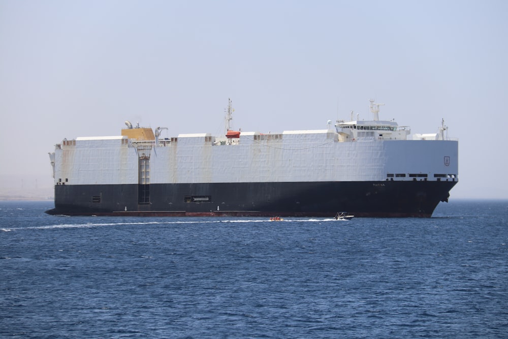 white and black ship on sea during daytime