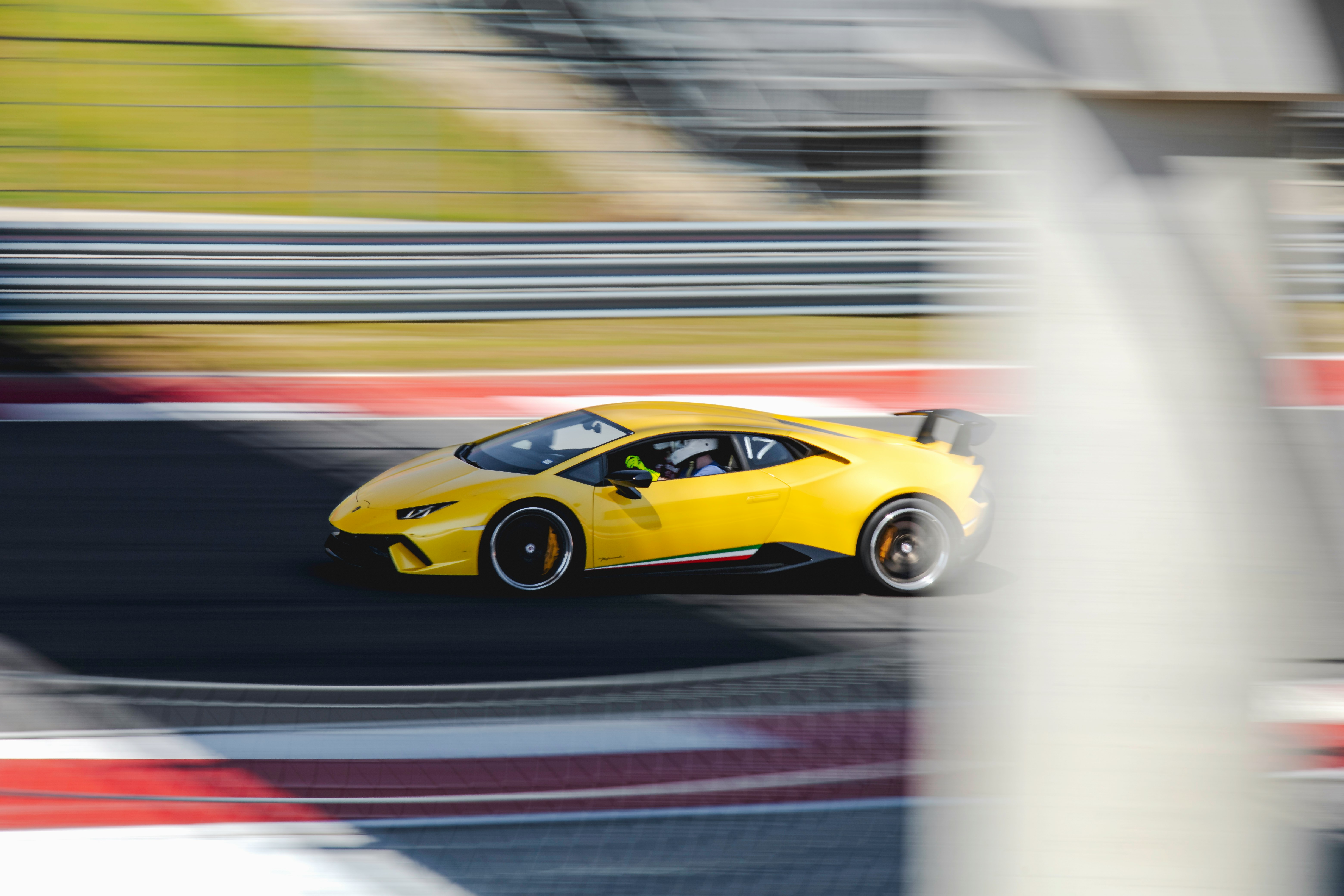 yellow ferrari 458 italia on road