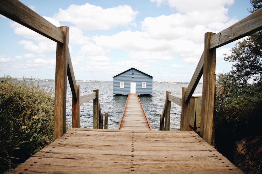 brown wooden dock on sea during daytime