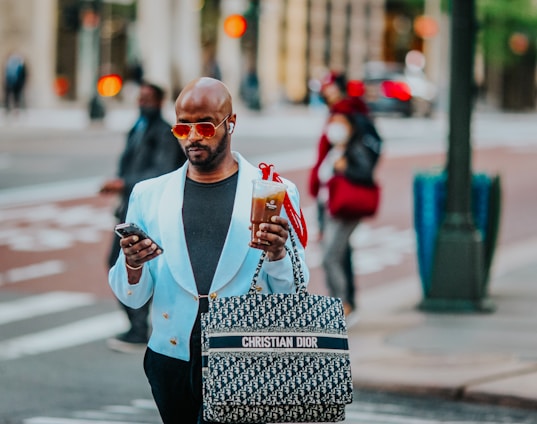 man in white long sleeve shirt holding white ceramic mug