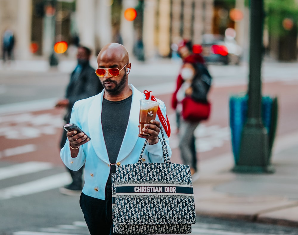 man in white long sleeve shirt holding white ceramic mug