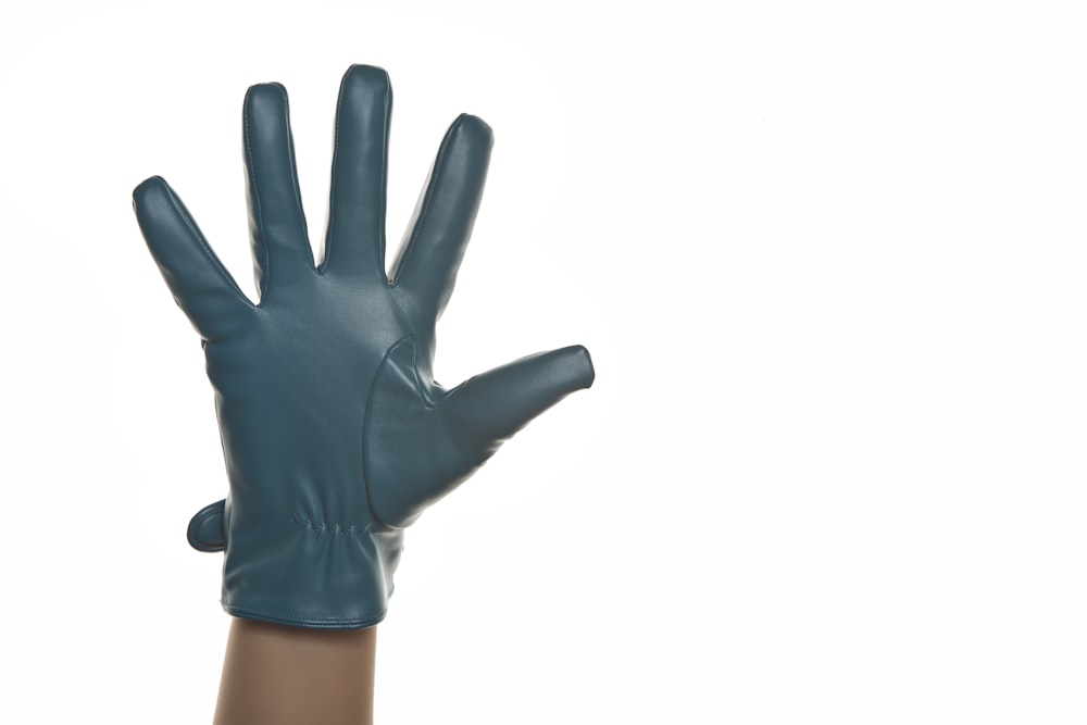person in black leather gloves