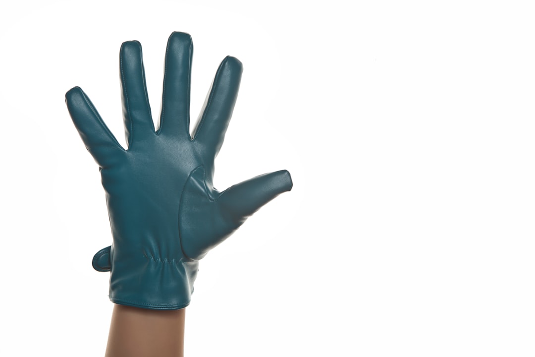 person in black leather gloves