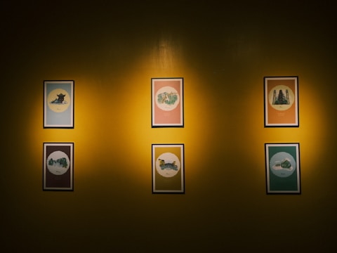 A gallery wall displaying six framed screenshots of diverse software projects.