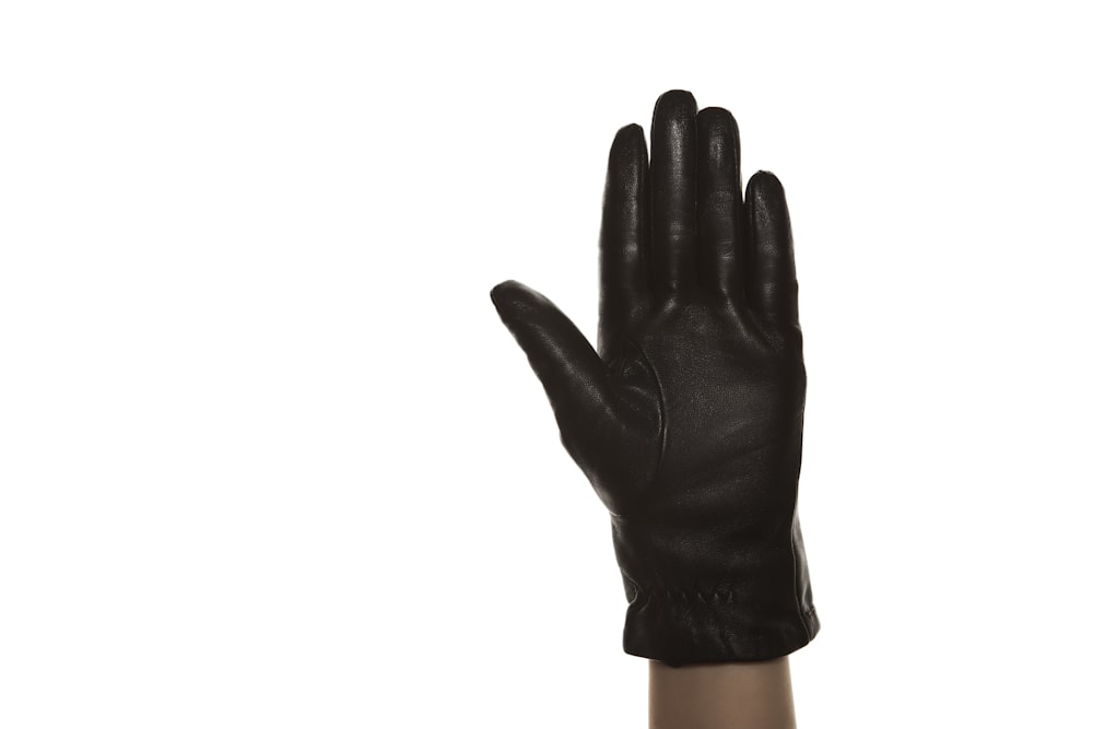 person in black leather gloves