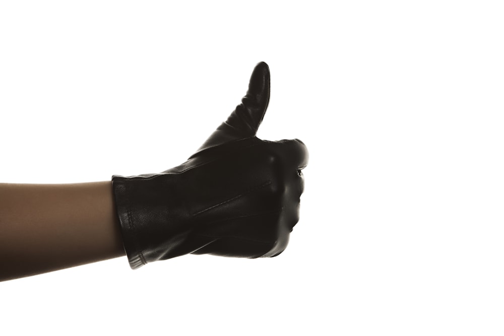 person in black leather gloves