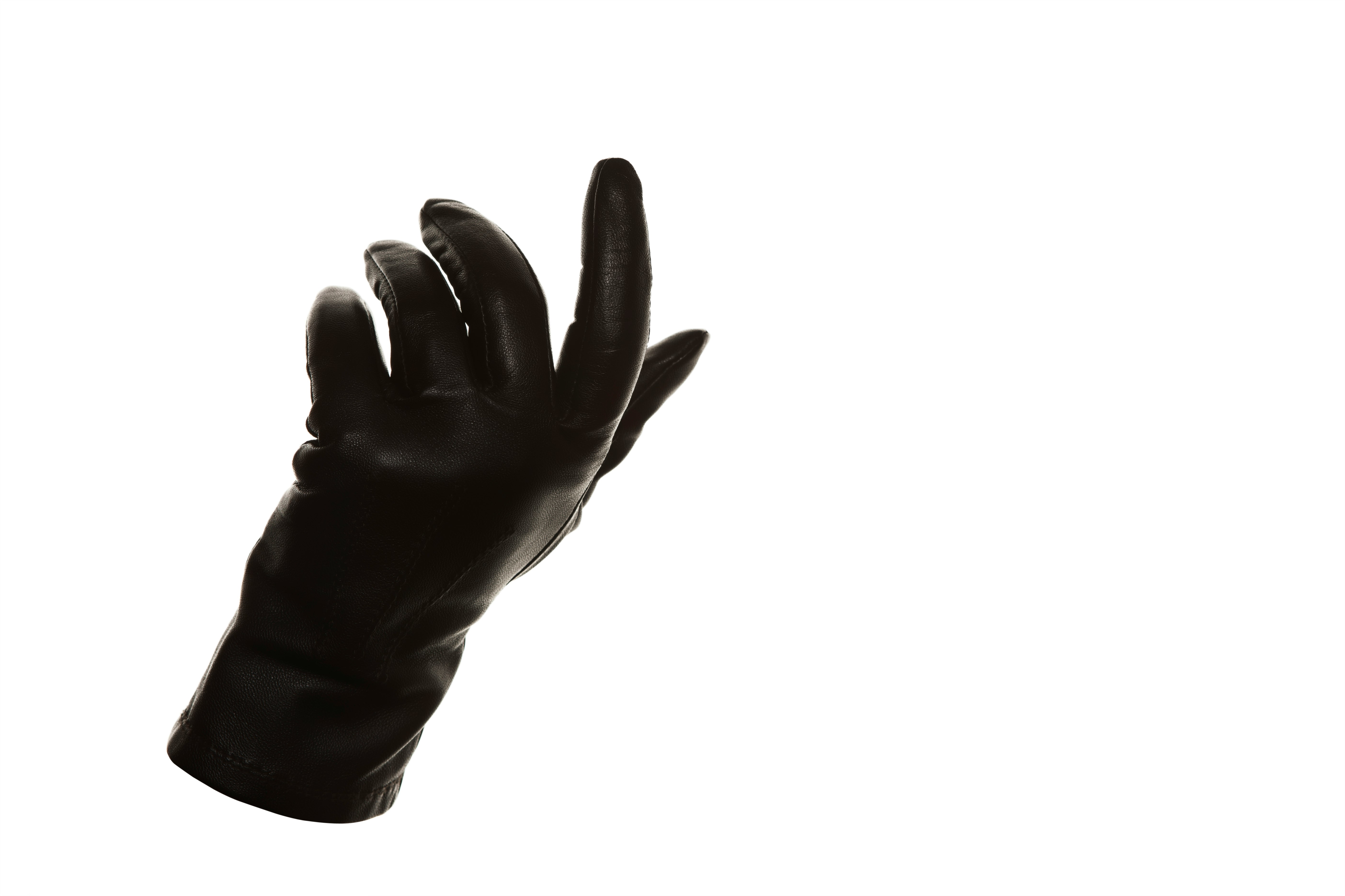 persons hand with black background